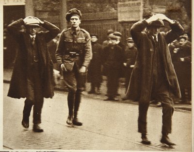 Two Sinn Fein members being arrested by British troops during a raid on the Ministry of Labour offices in Dublin, 1920 by Irish Photographer
